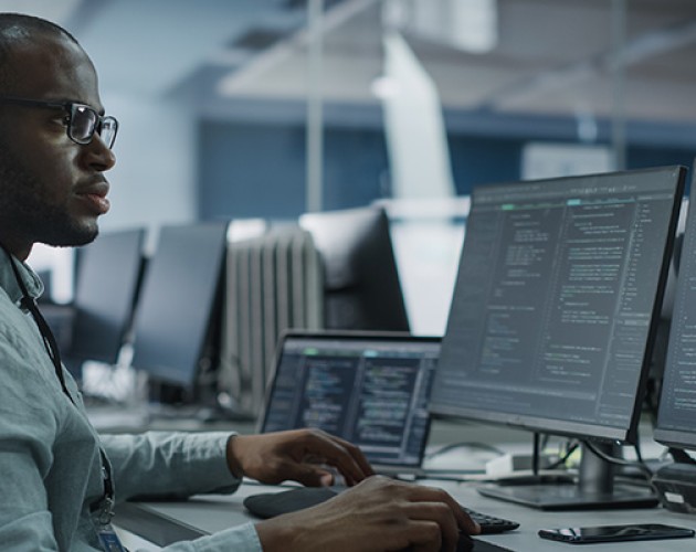 Stock photo of programmer at work