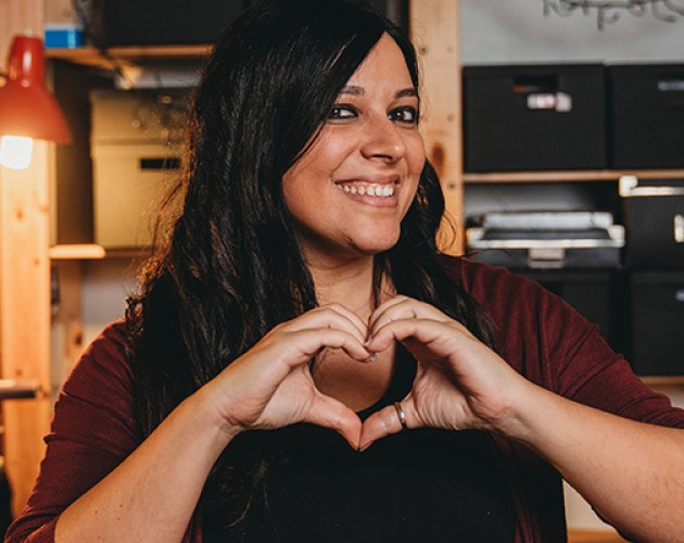 Italian American woman making a heart with her hands