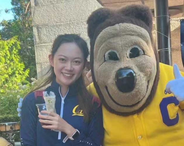 Lucy Zhang and Berkeley Oski mascot take photo together