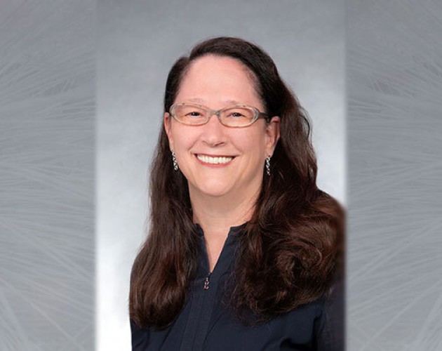 Accounting and auditing instructor Marjorie Bailey with gray background. Photo.