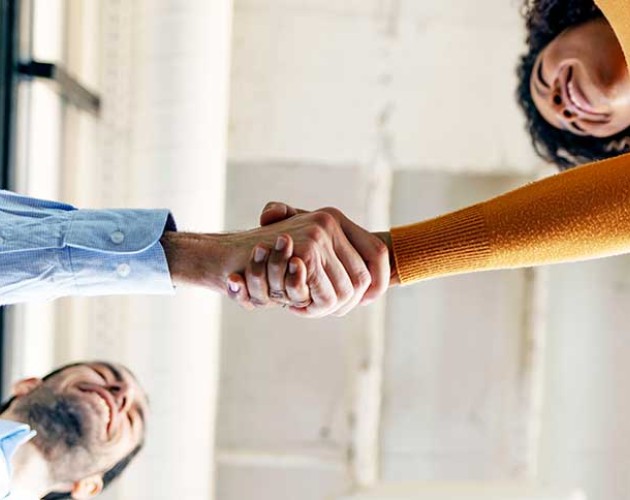 Photo of two people shaking hands