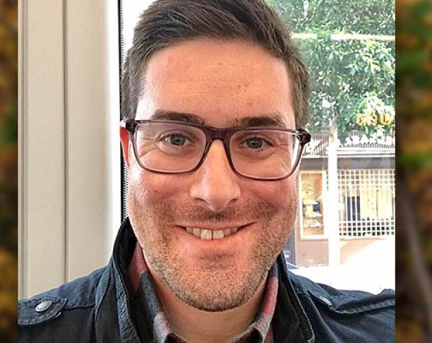 Headshot of Post-Baccalaureate Program for Counseling and Psychology Professions graduate Sam Kushner sitting in front of a window