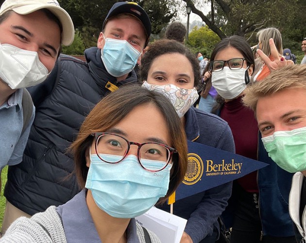 Group selfie of international students wearing masks on UC Berkeley campus 