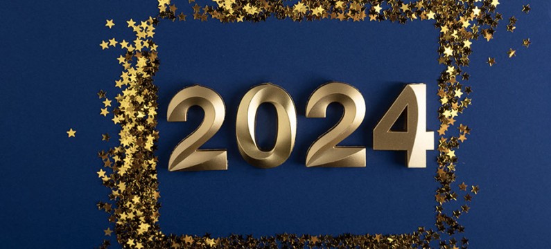 2024 numbers on blue background with gold confetti around them