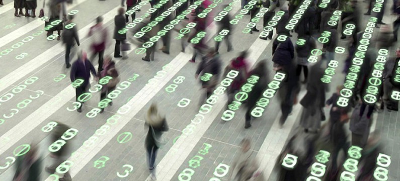 People walking in a city square composited with a grid of glowing, electronic numbers.