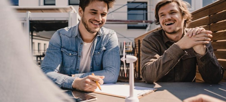 Young entrepreneurs brainstorming on a roof terrace 