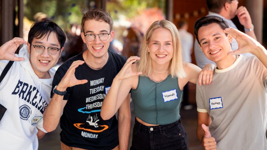 Hannah Boettge and friends making a C shape with their hands