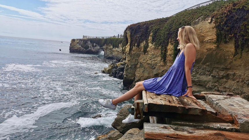 Side view of Hannah Boettge at a beach