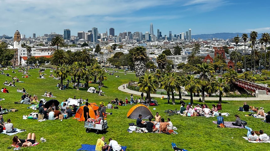 Photo of people laying on grass at Dolores Park in San Francisco