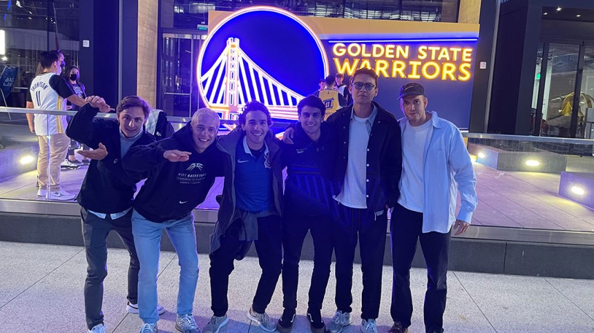 Harry and friends take photo in front of San Francisco Warriors sign