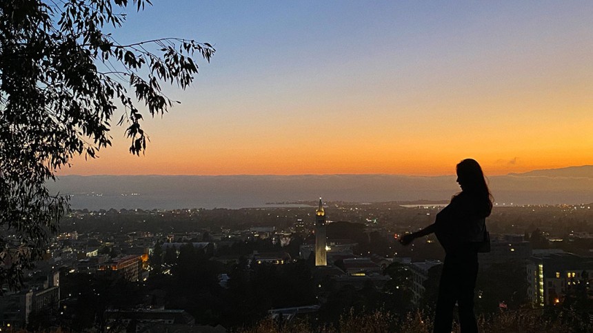 Photo of Jeongseo Kim from behind taking in the sunset at Berkeley Big C