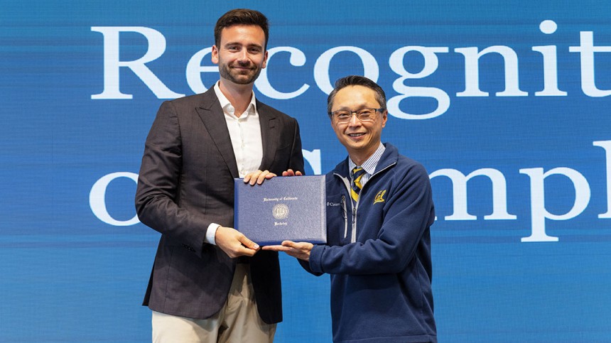 Lucas Mortier and Henry Tsang pose for a photo while giving BHGAP certificate