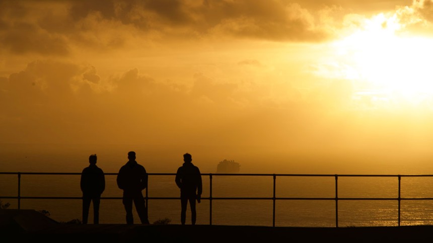 Lucas and friends enjoying the sunset view at one of the beautiful California beaches