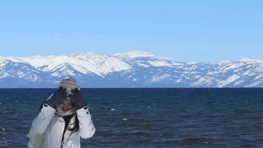 Vera Xiaole Guo standing in front of Lake Tahoe