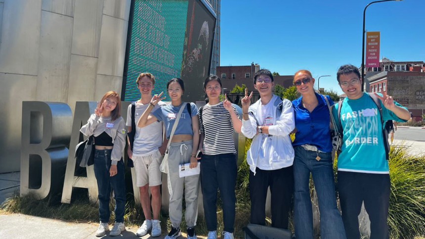 Xiangjian Zhang and friends stand in front of BAMPFA sign