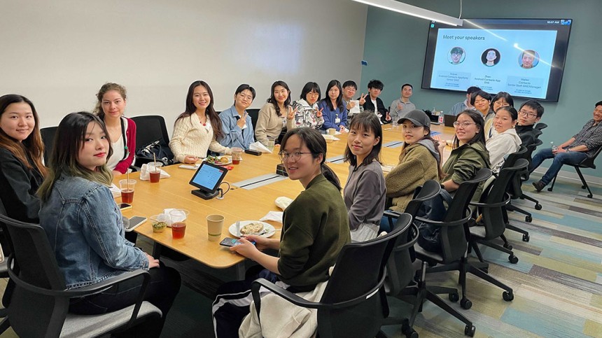 International students sit around table at Google