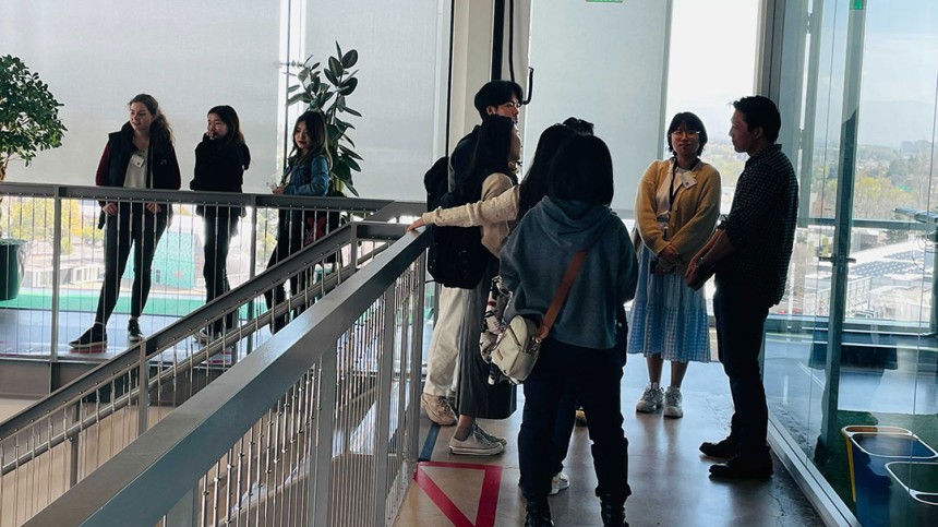 International students have chat in hallway at Google